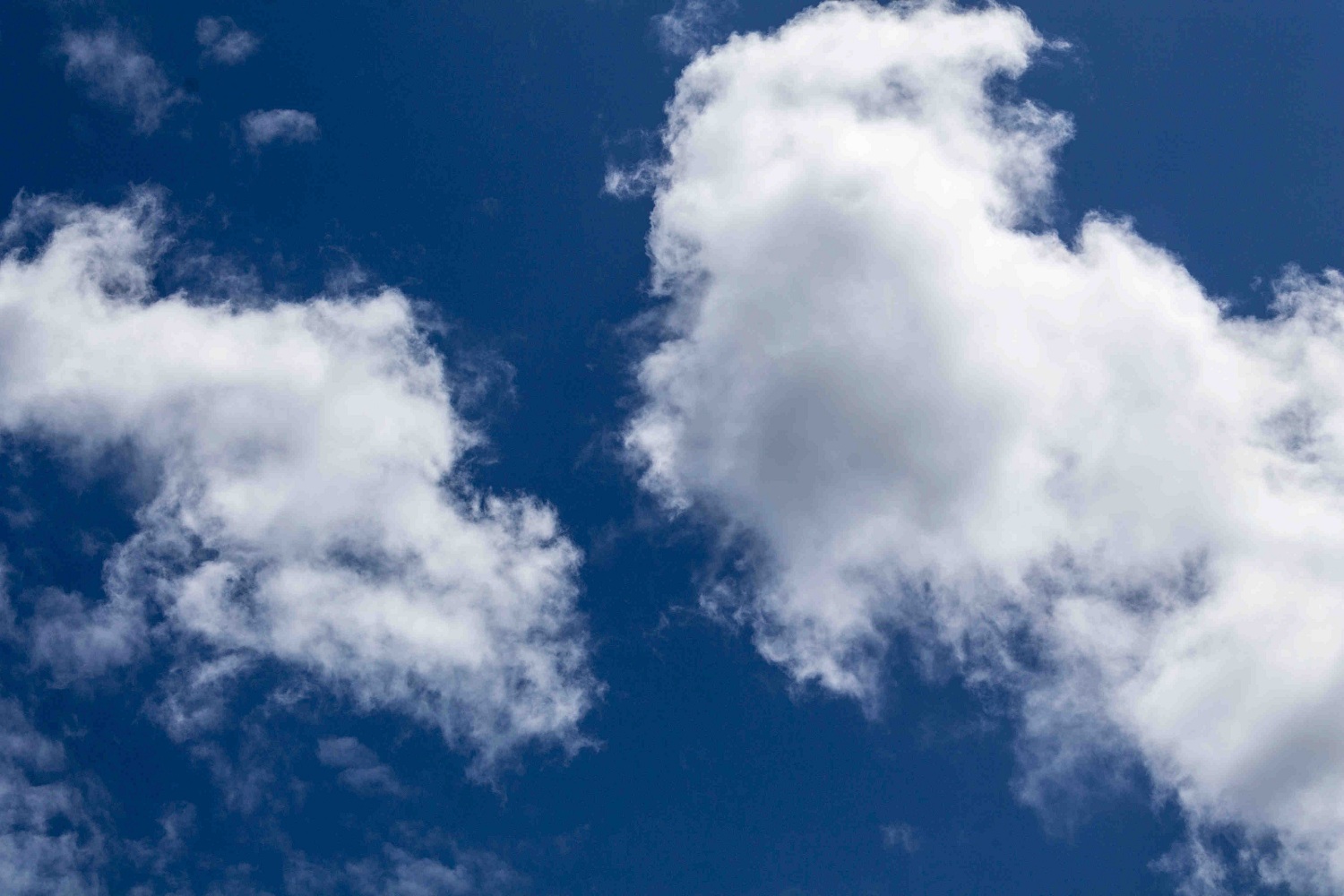 Image of Billowing White Clouds and A Deep Blue Sky.